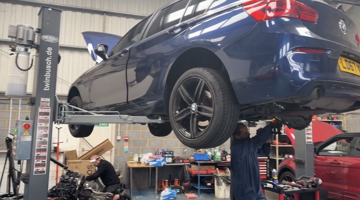 Car raised on the ramp for underbody inspection at KITH Cars Garage & Bodyworks, Hackbridge